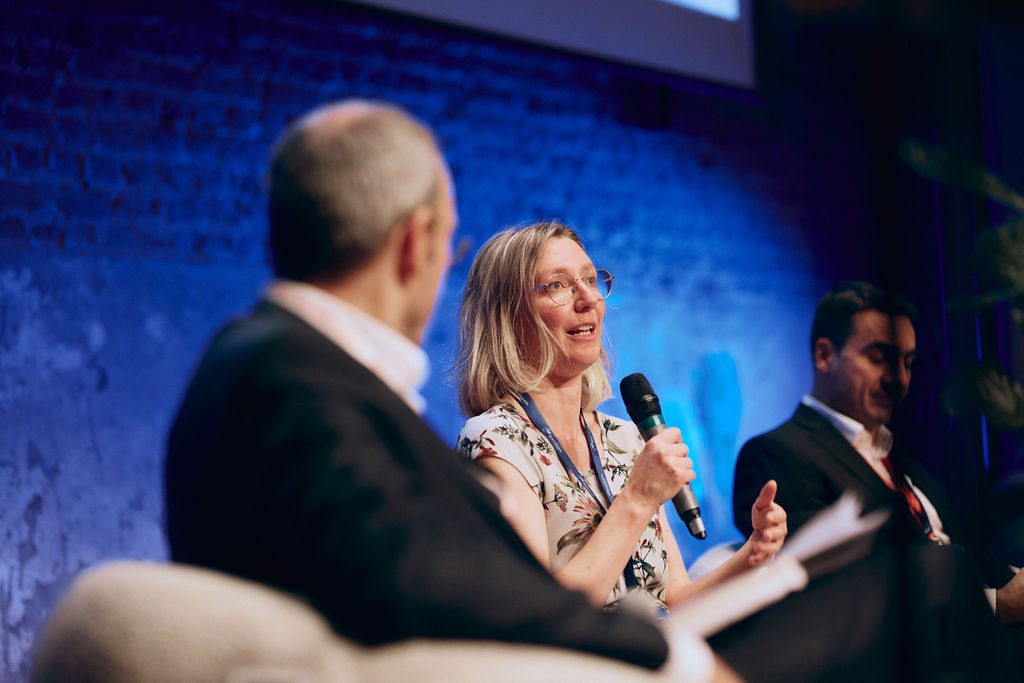 Woman is holding a microphone