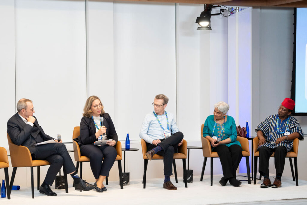 Persons discussing at a panel